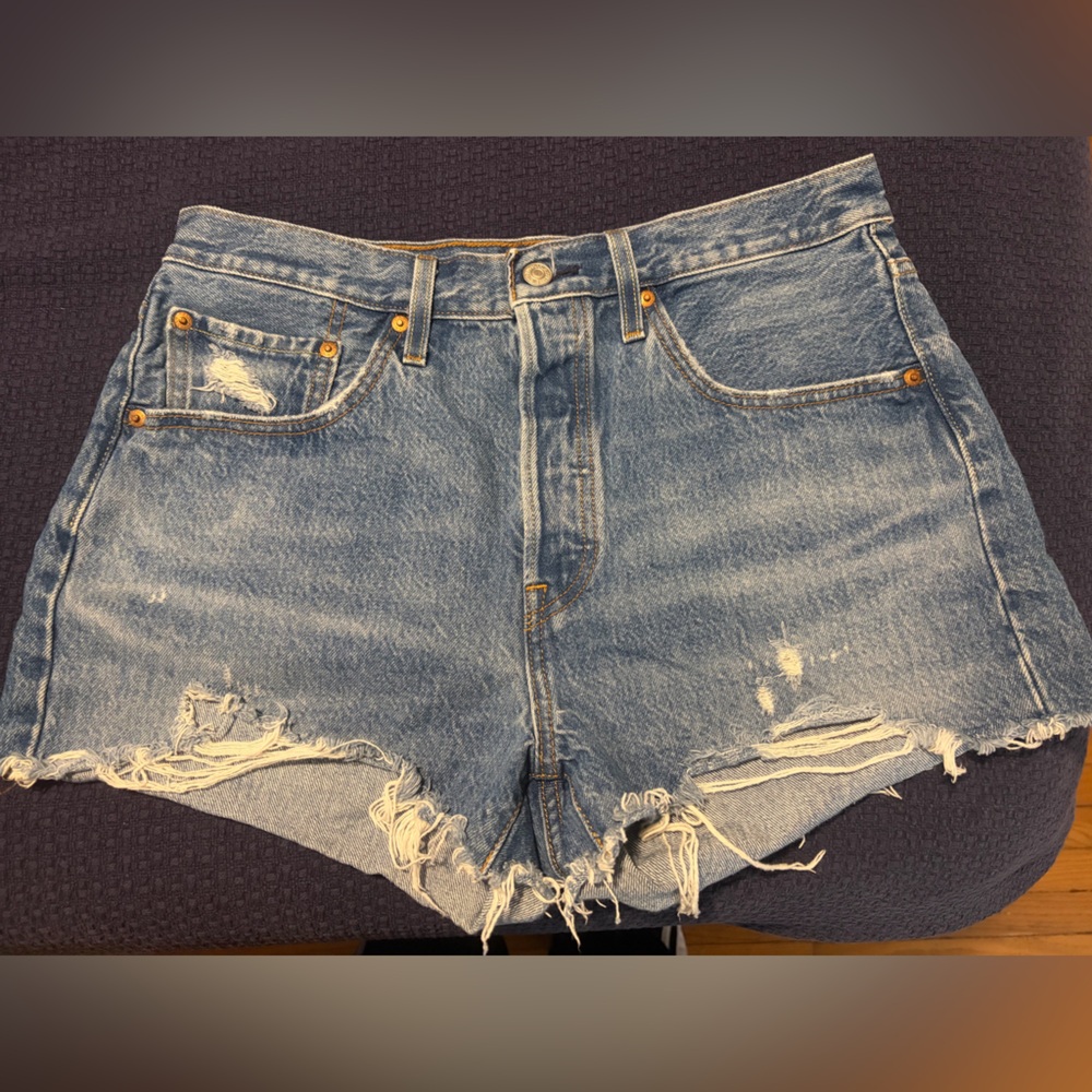 Levi's light blue denim shorts with tan leather patch